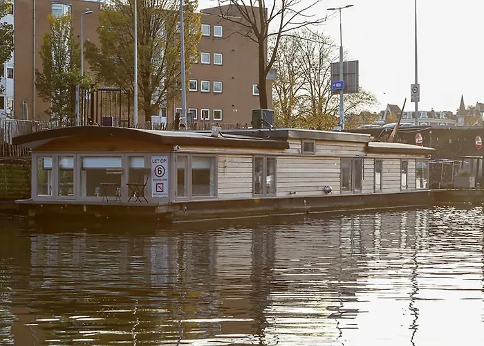 Houseboat Next To Amstel Hotel Amsterdam